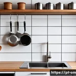 효율적인 주방 수납 아이디어 - A modern kitchen scene featuring suspended shelves installed above a sleek sink area, holding variou...
